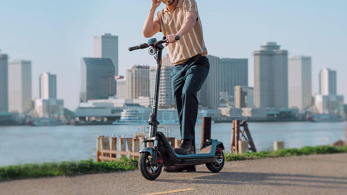 A man riding a scooter