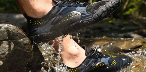 A person's feet in water