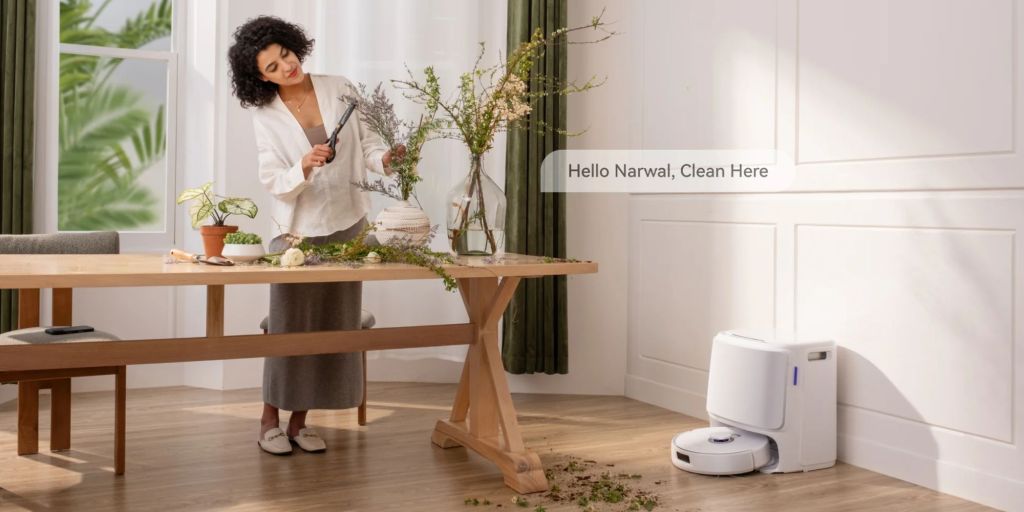 Image showing a women asking Narwal's Freo Z10 robot vacuum to clean.
