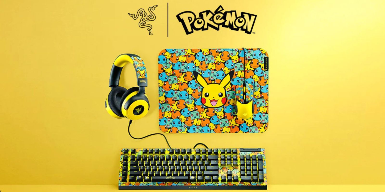 A keyboard and headphones on a yellow background