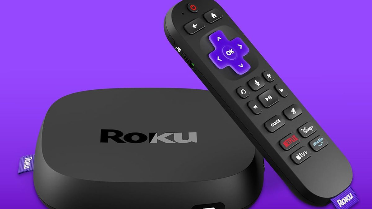 A remote control next to a device