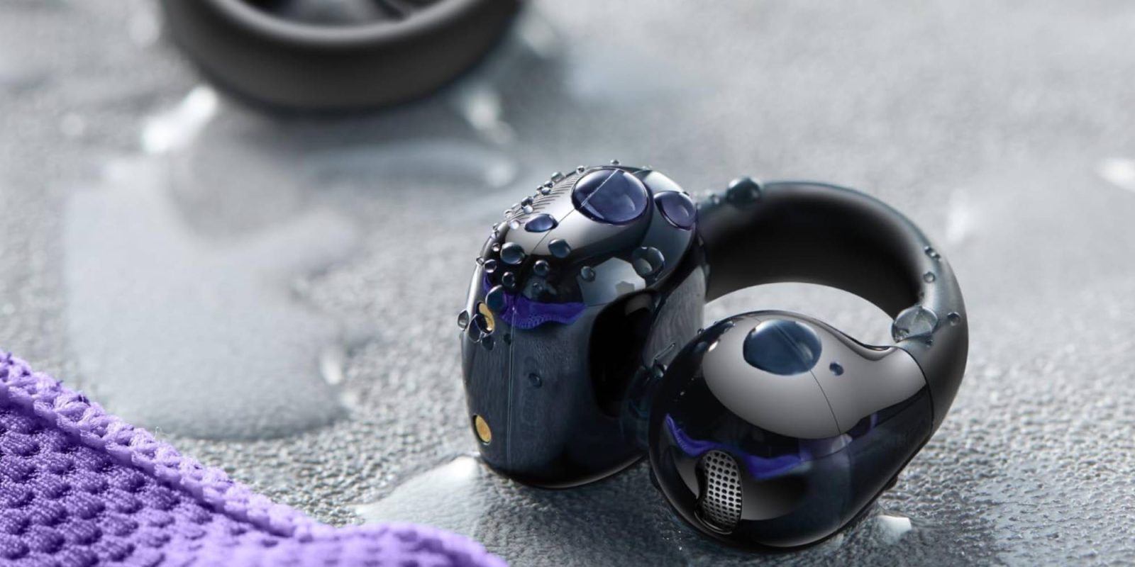 A black earphones with water droplets on it