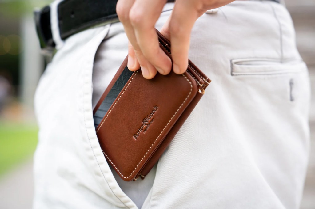 A person pulling a wallet out of his pants