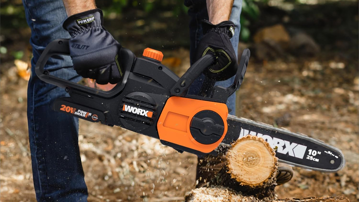 A person holding a chainsaw