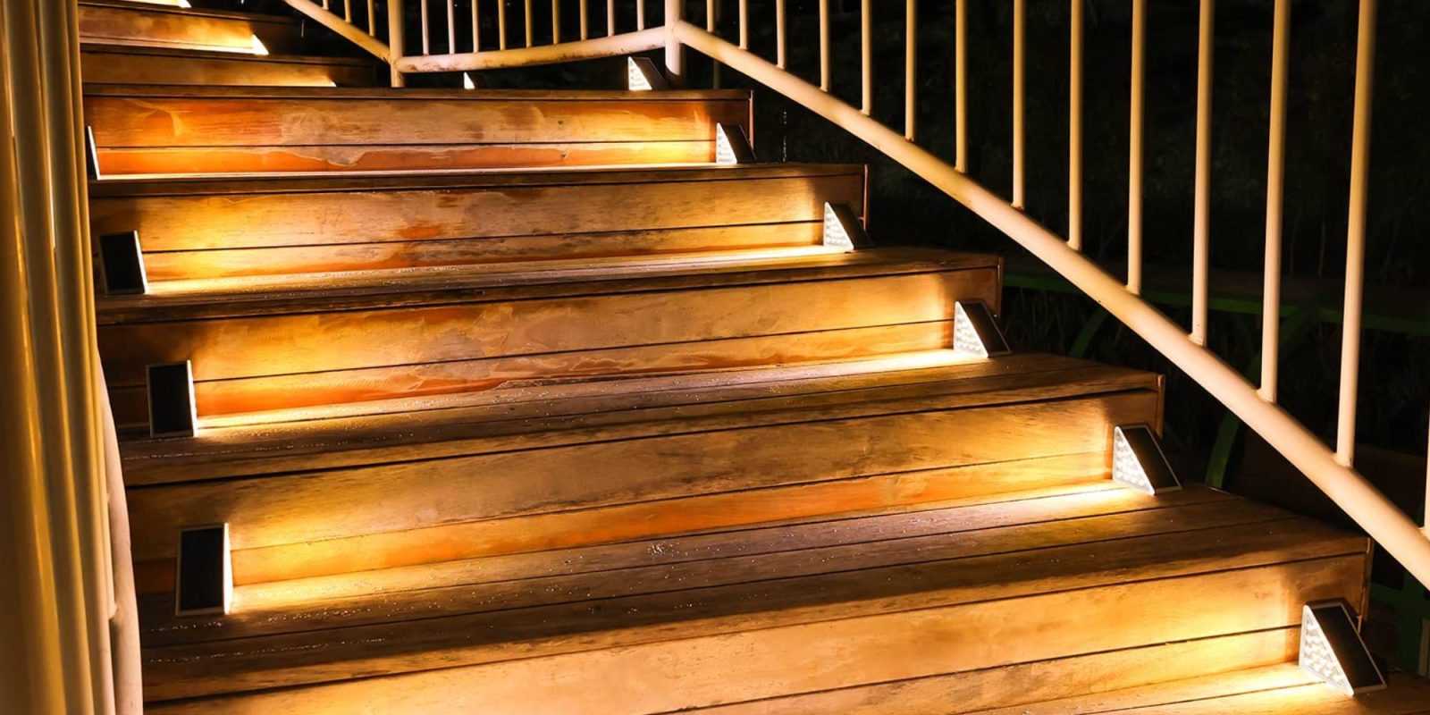 A wooden stairs with lights on