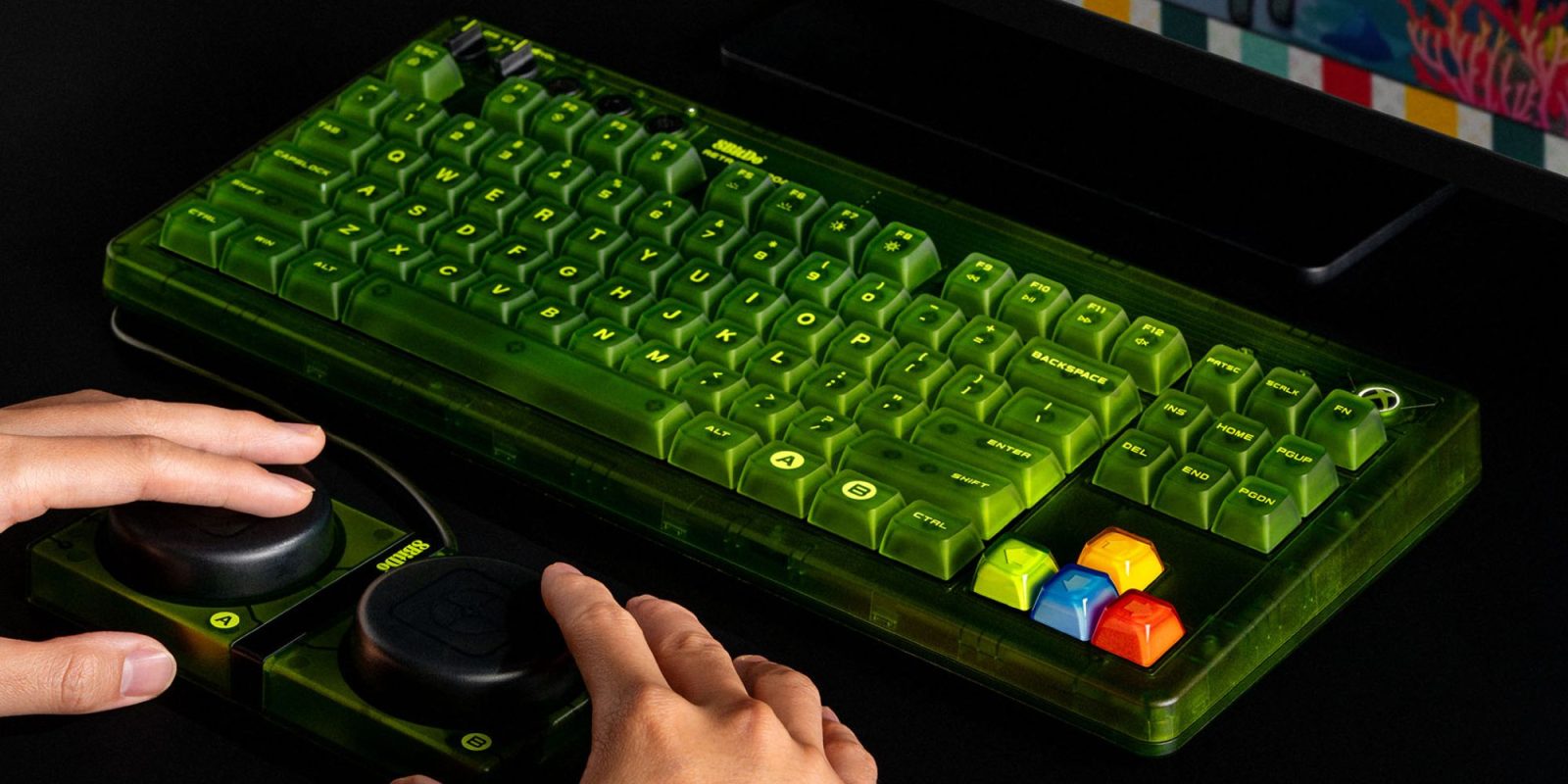 Image showing a person using 8Bitdo's Retro 87 Xbox Edition keyboard.