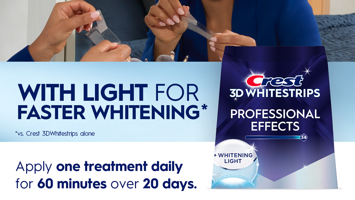 A woman holding a whitening tool