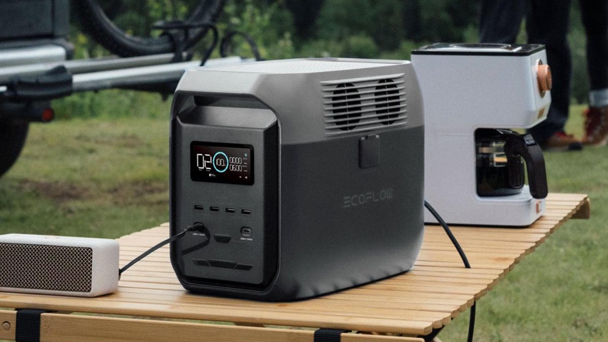 A black and grey machine on a wooden table