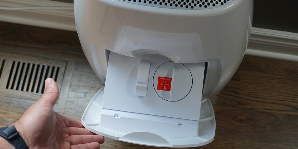 A white device with a red label