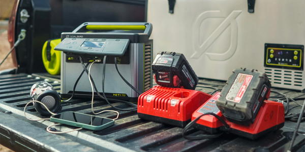 A group of power tools on a black surface