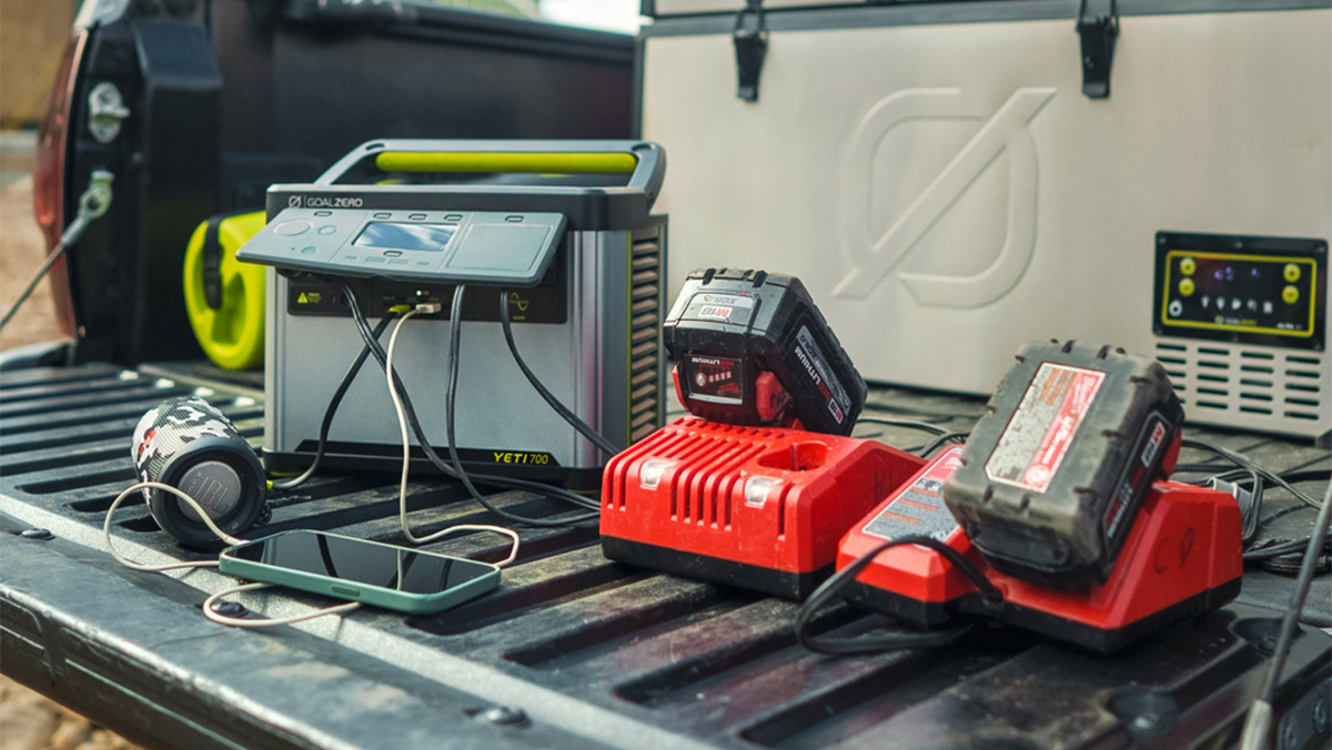 A group of power tools on a black surface