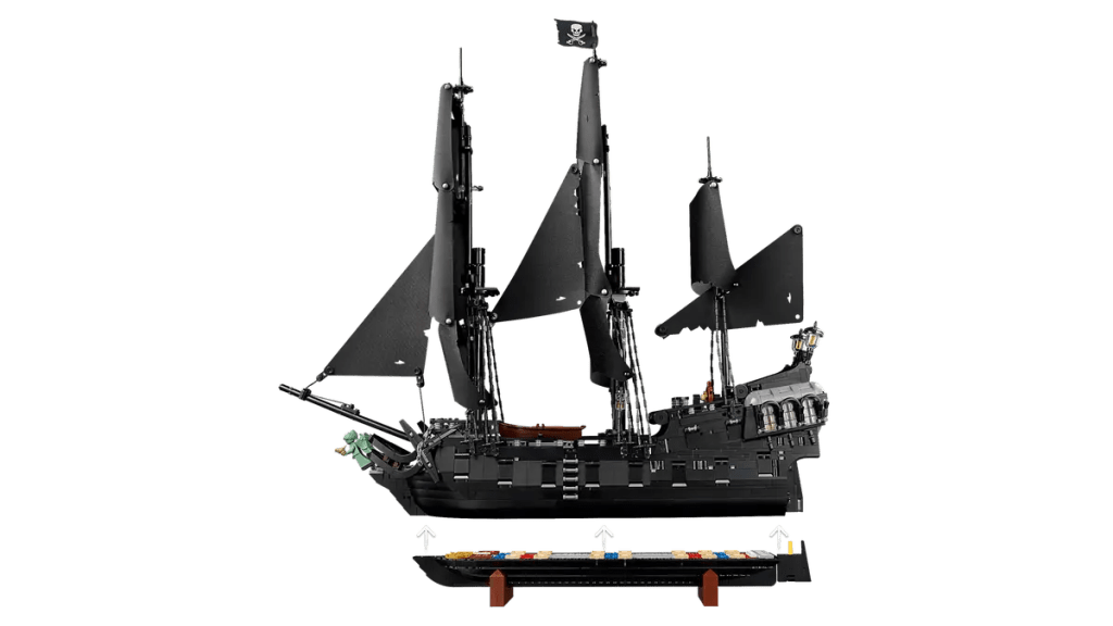 A black pirate ship with black sails and a black boat