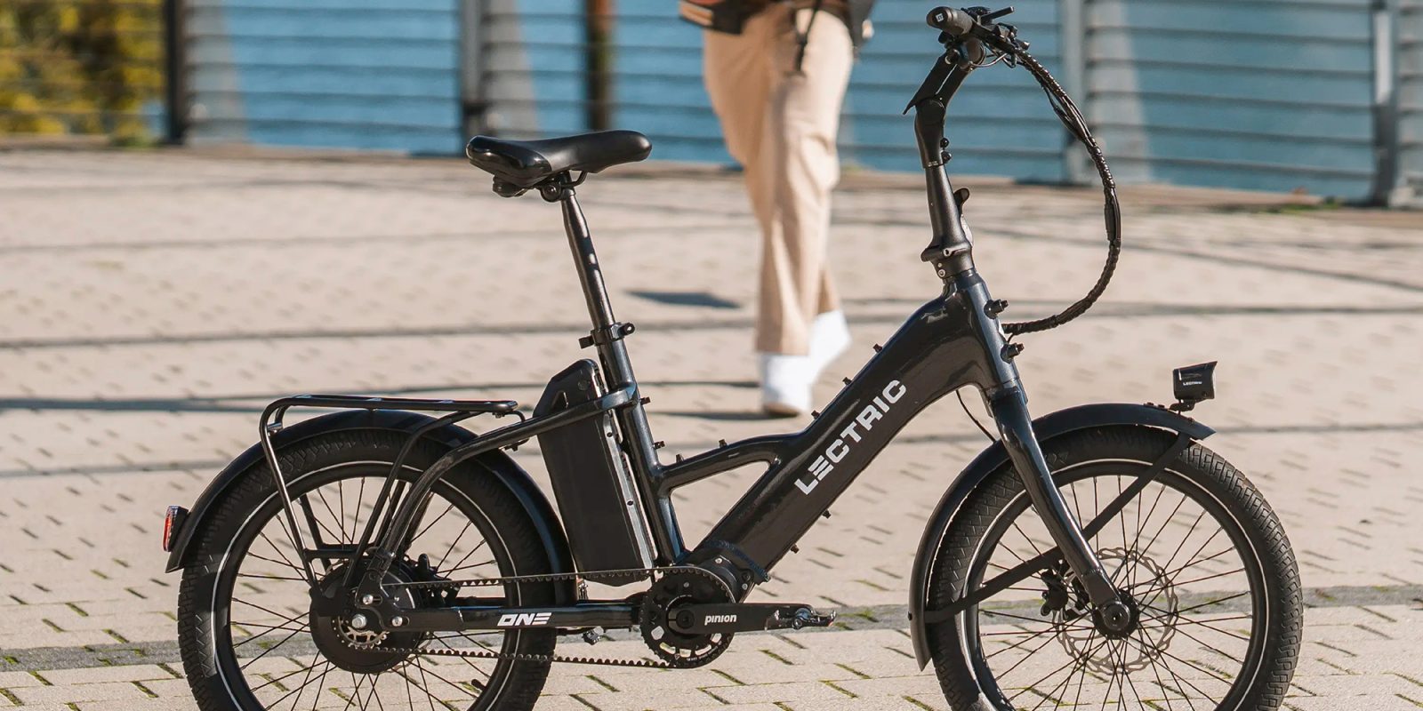 A black electric bike on a brick surface