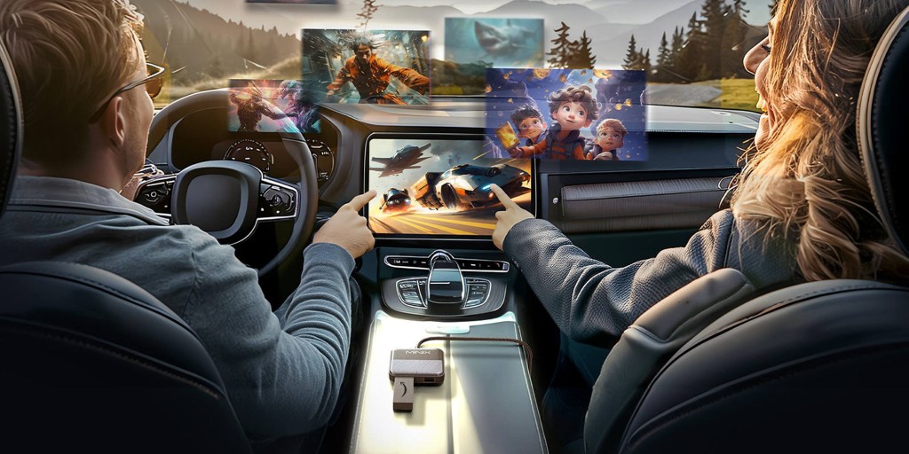 A man in a car with a screen on the front of his