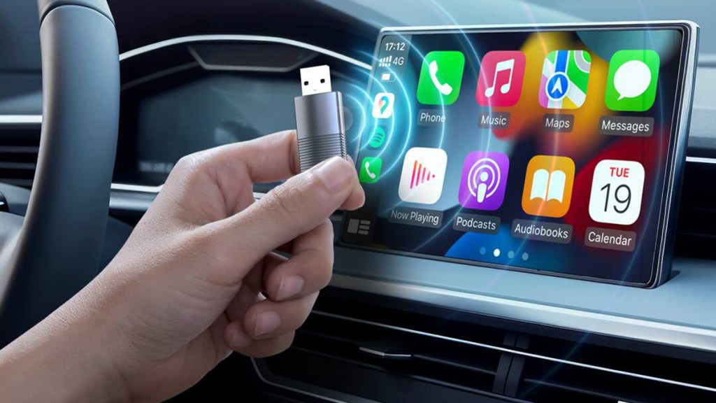 A hand holding a usb drive