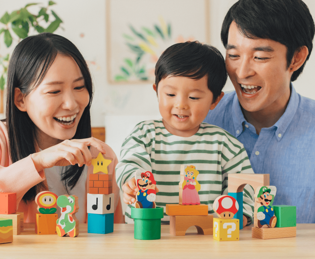 A man and woman playing with a child