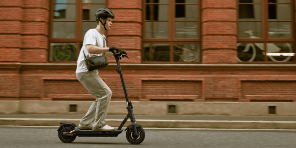 A man riding a scooter
