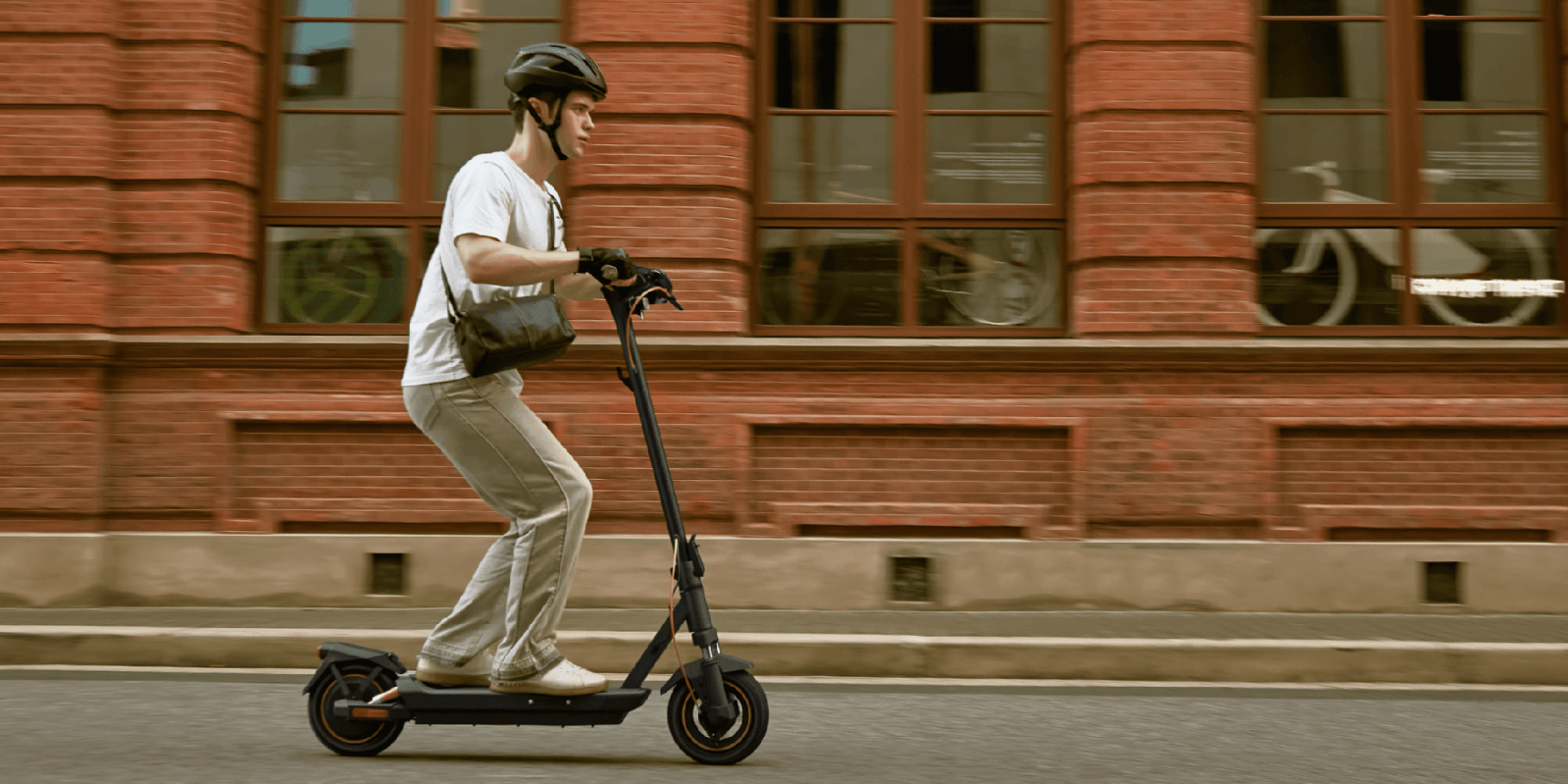 A man riding a scooter