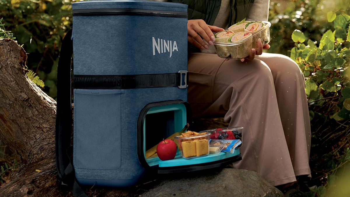 A person holding a container of food