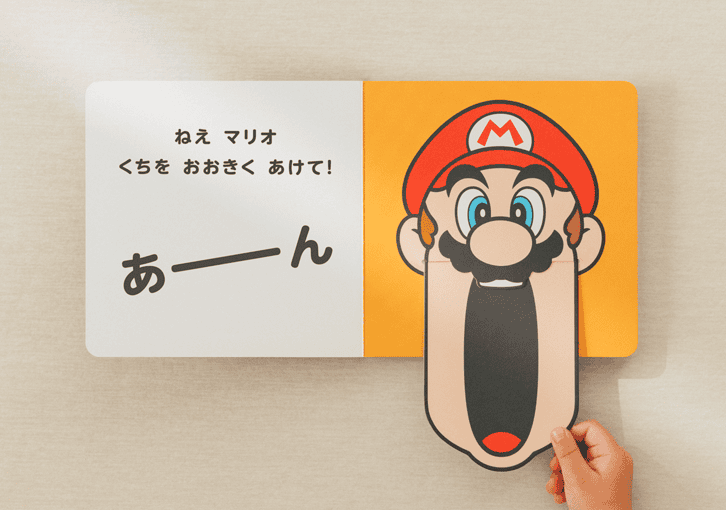 A hand holding a paper cut out of a cartoon character