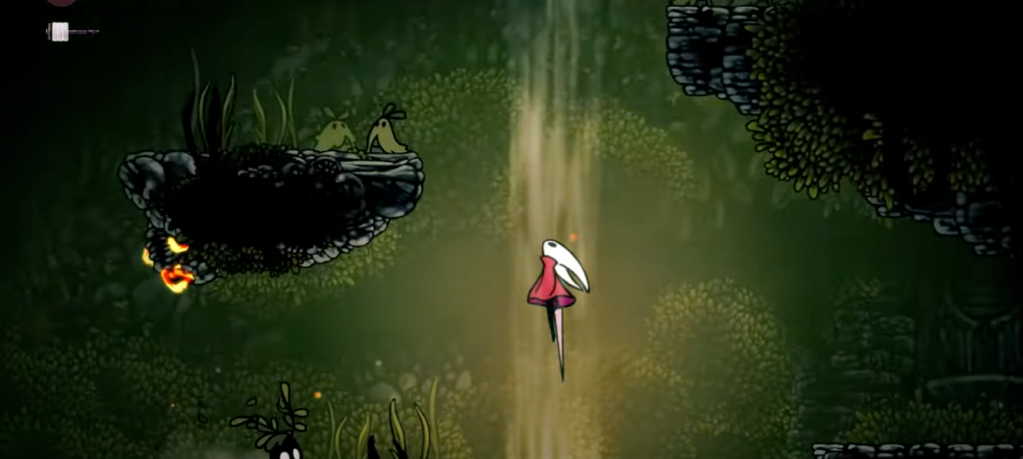 A video game screen with a cartoon character in the middle of a forest