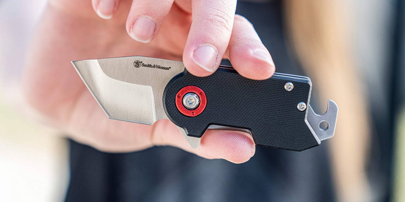 A person holding a pocket knife