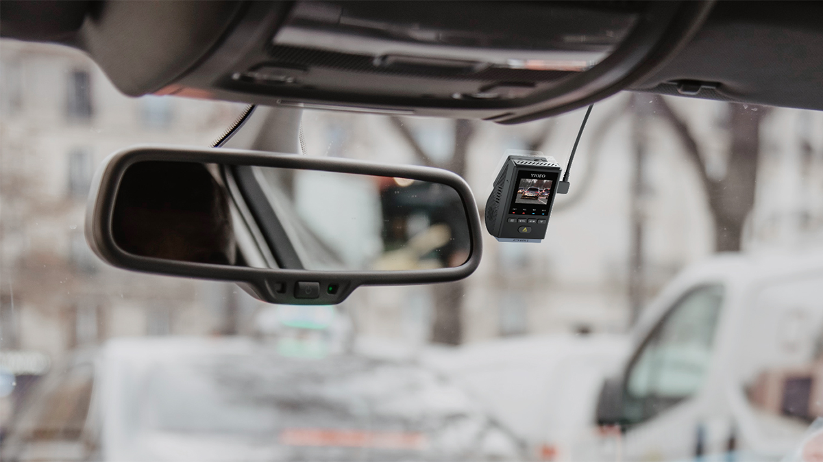 A rear view mirror of a car with a camera