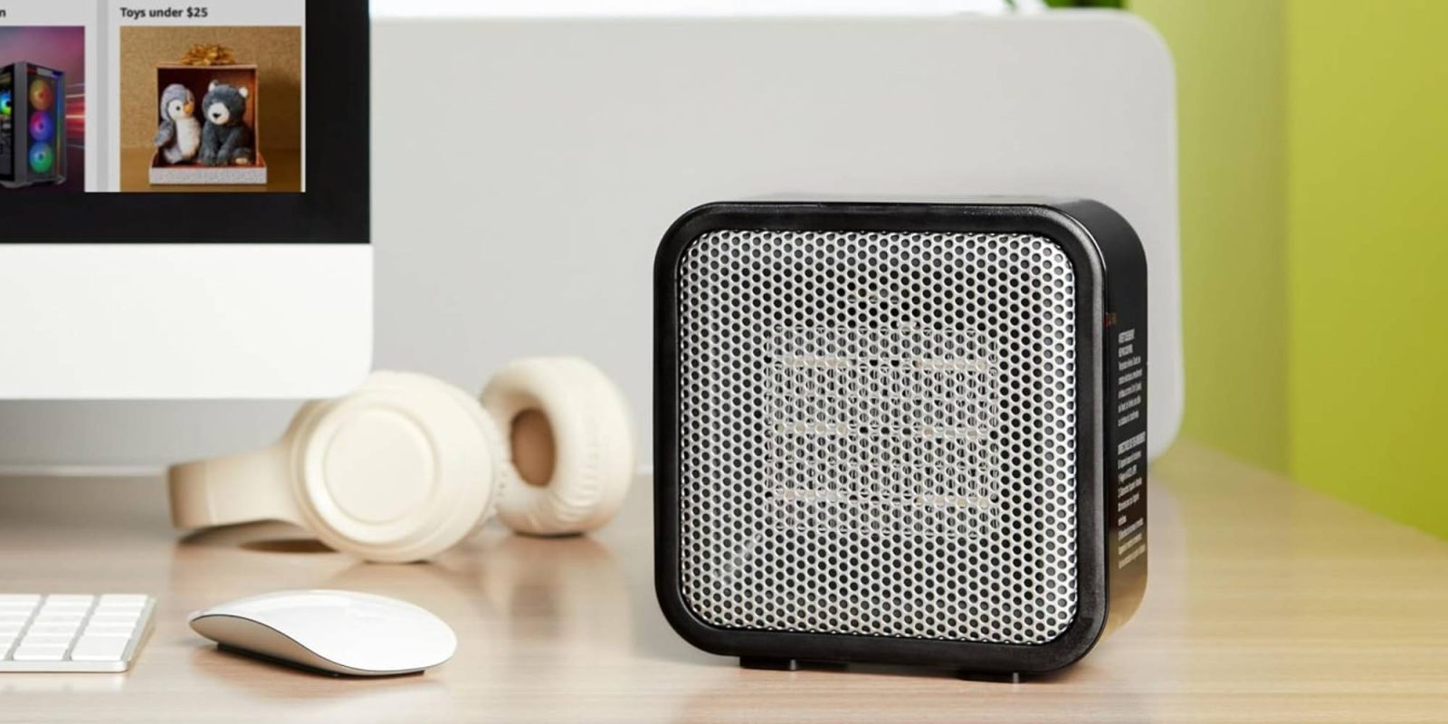 A black and white speaker on a desk