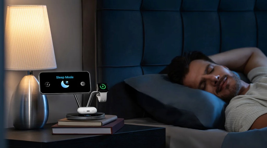 A man sleeping in bed with a smart watch