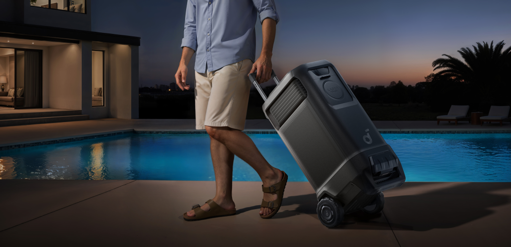 A man walking and pulling the Anker nebula x1 pro by handle