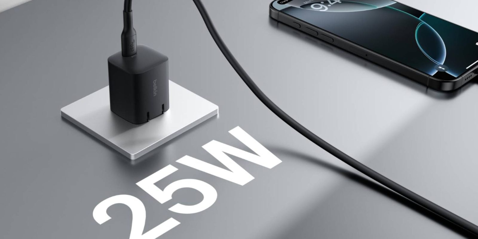 A black charger plugged into a charging station