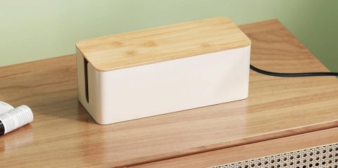 A rectangular white box with a wooden lid