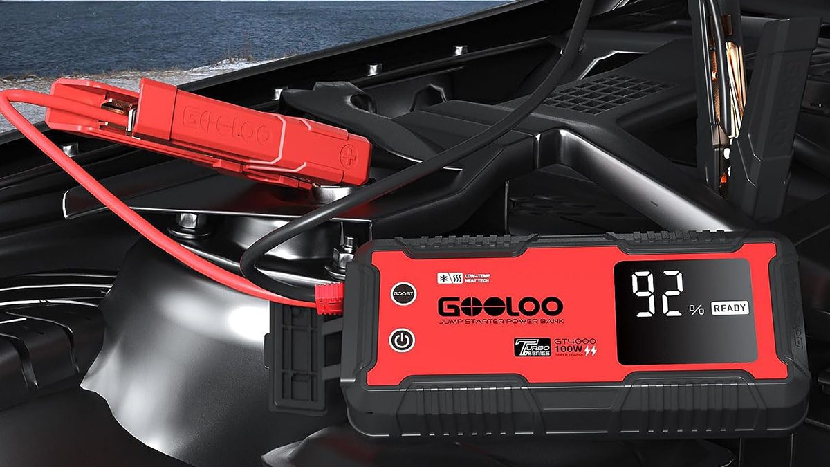 A car battery charger with a red and black battery