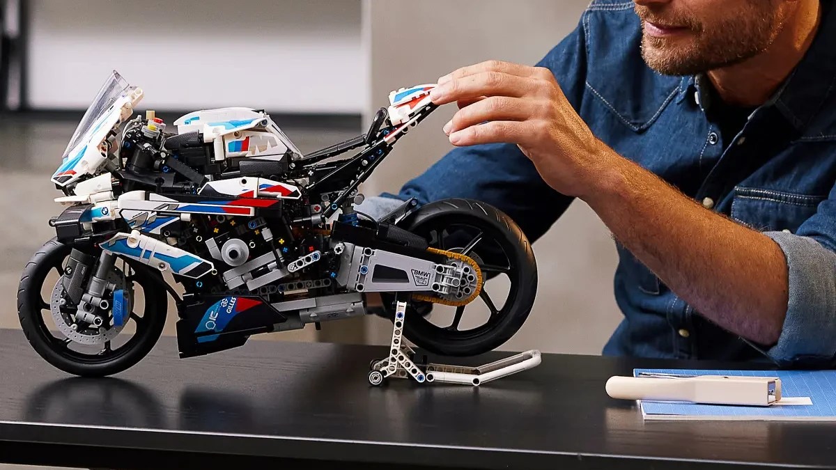 A man holding a toy motorcycle