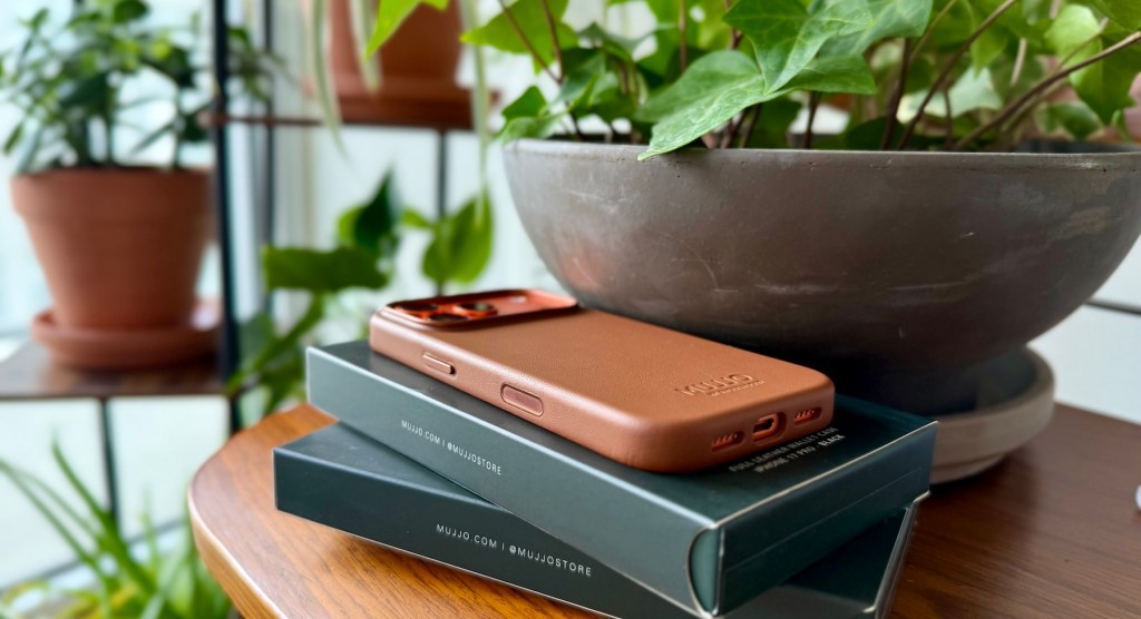 A phone on top of books