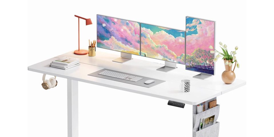 A desk with multiple monitors and a keyboard