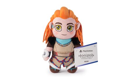 A stuffed toy with a sign