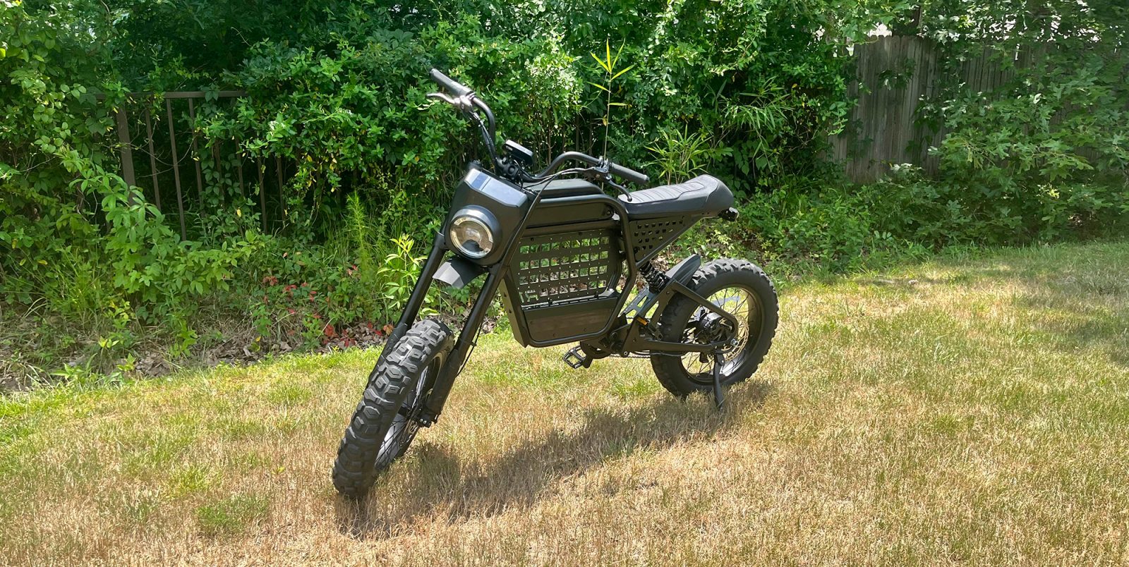 A motorcycle parked in a grassy area