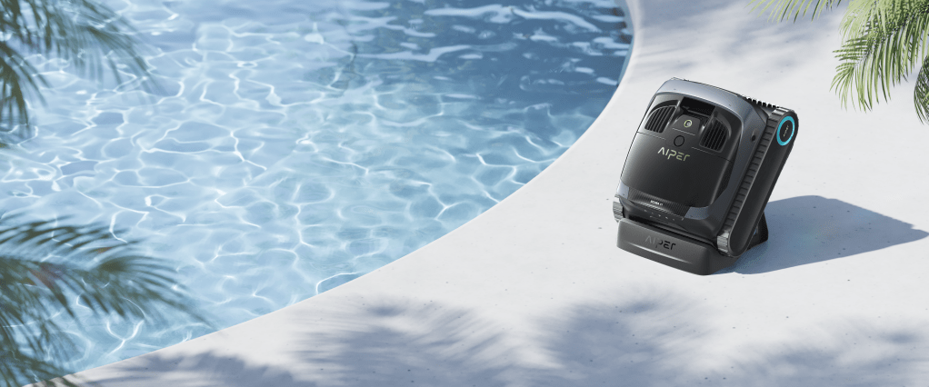 A vacuum cleaner next to a pool