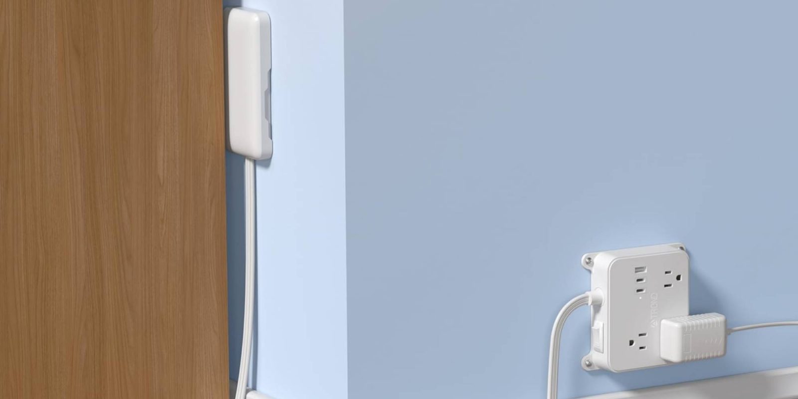 A white cord attached to a blue wall