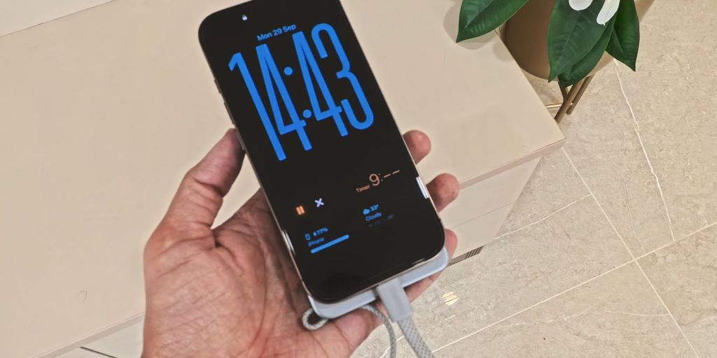 A hand holding a phone