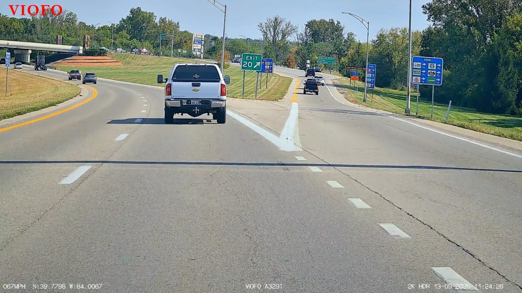 A truck driving down a road