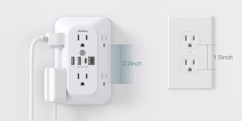A white outlet with a plug in and a rectangular outlet with a rectangular outlet