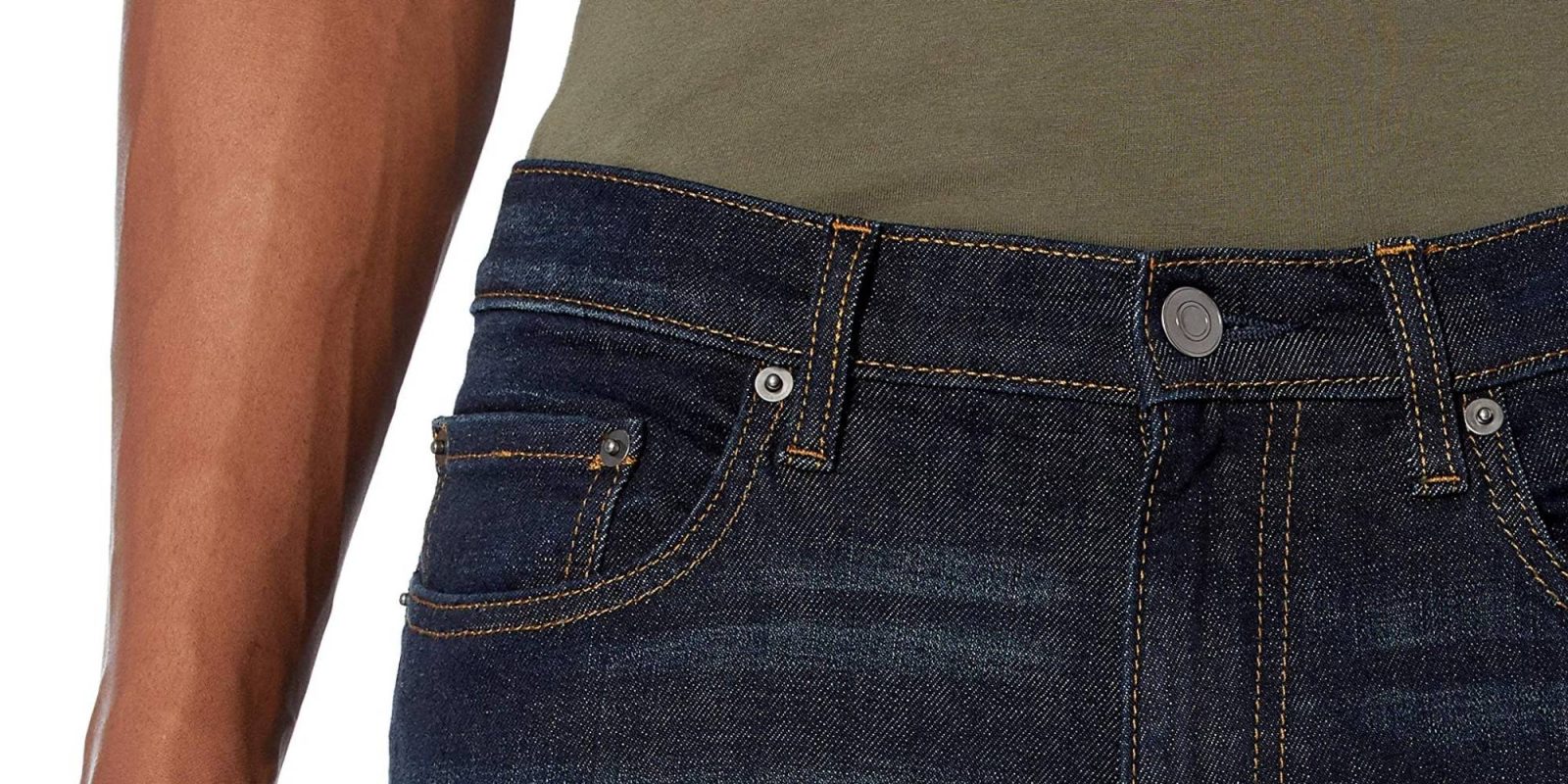 A person wearing a green shirt and blue jeans