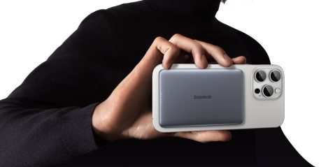 A person holding a rectangular device