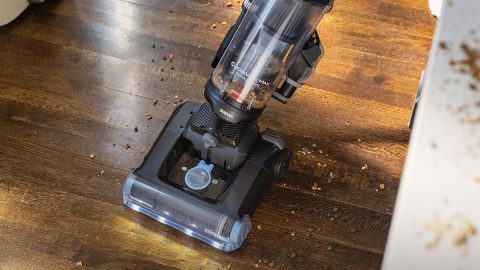 A vacuum cleaner on a wood floor