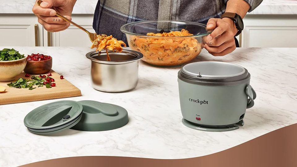 A person cooking food in a crock pot