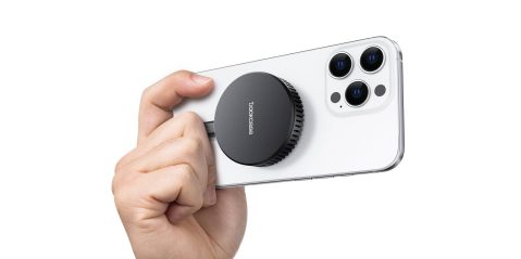 A hand holding a phone camera