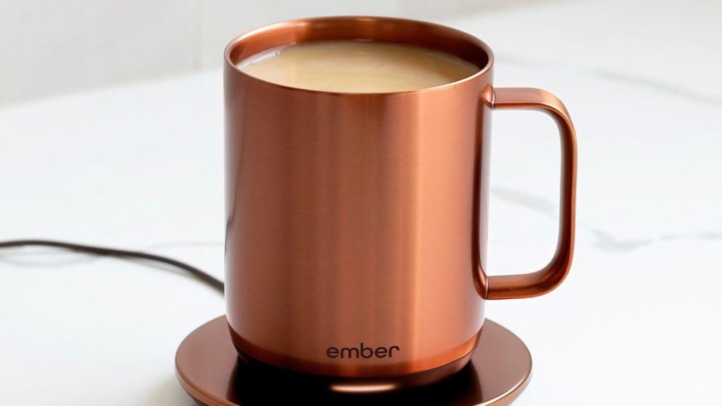 A copper mug with liquid in it