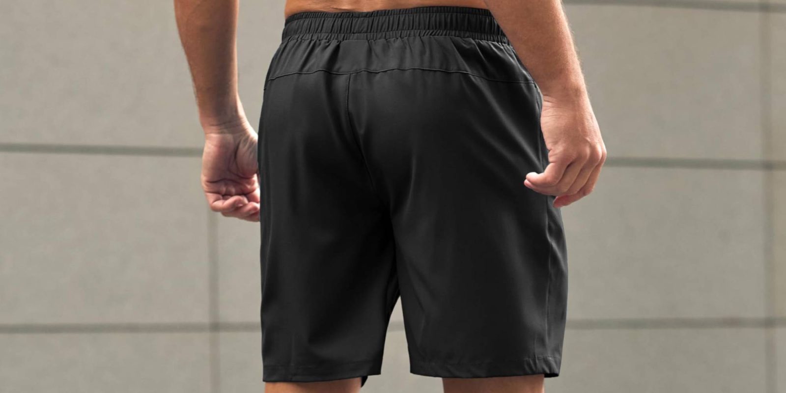 A man wearing black shorts